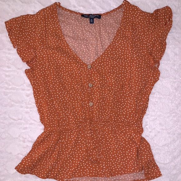 orange and white polka dot shirt